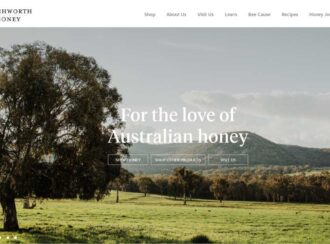 Homepage Of Beechworth Honey Featuring A Scenic Landscape With Trees And Hills, And Text Promoting Australian Honey Products. Navigation Options Include Shop Honey, Shop Other Products, And Visit Us.